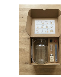 The BrewKit Lab 5 Gallon Brewing Kit — open box with fermenter, airlock, sanitizer, and ingredients